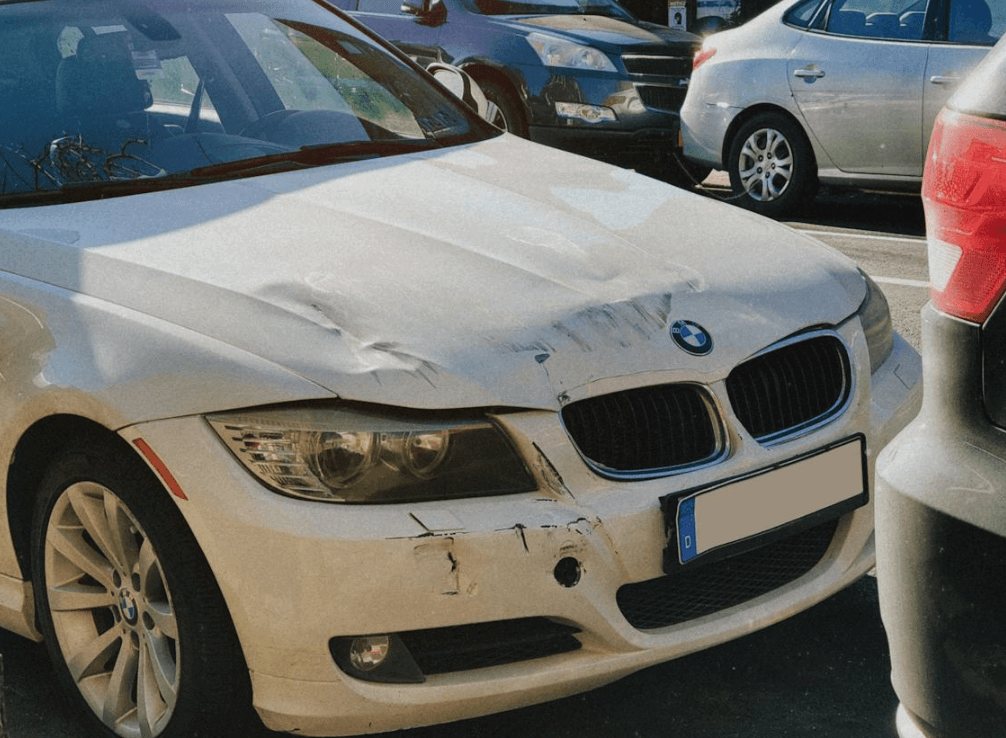 A white damaged BMW