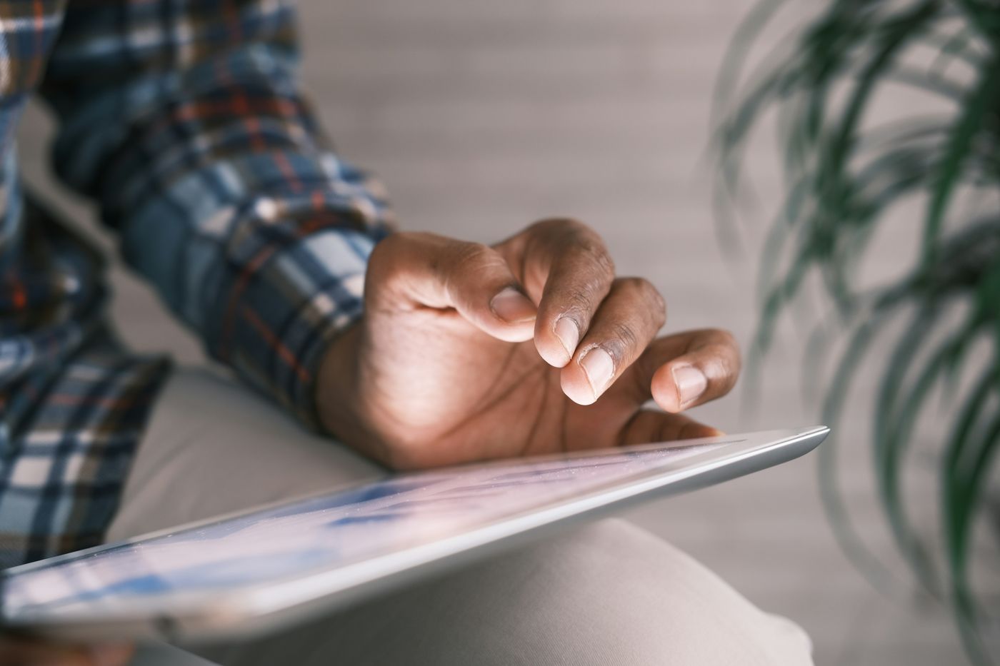 A person browsing the web on their iPad